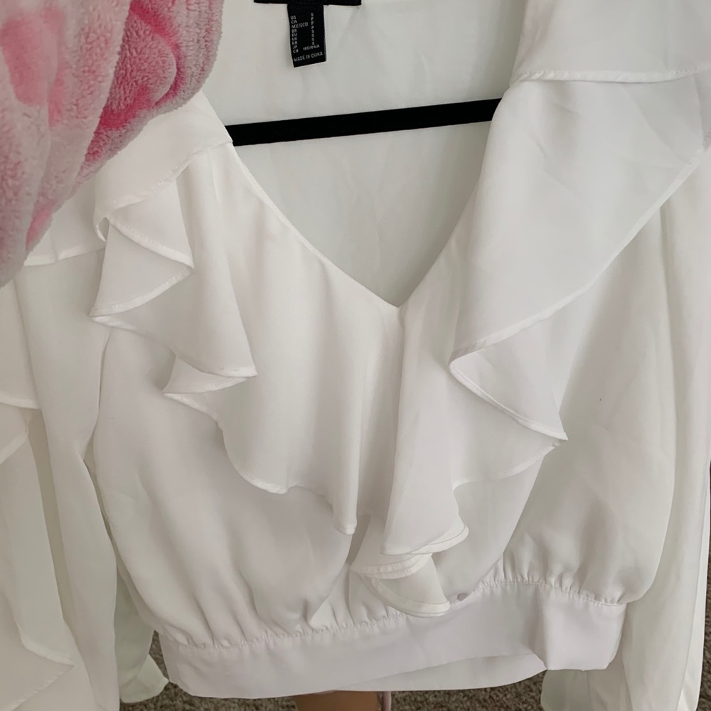 White blouse zipped up on the side  🤍